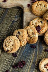 delicious dried cookies made of high-quality flour with dried red cranberries on the table