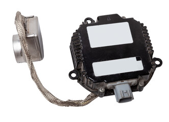 Spare part plastic car engine control unit with metal elements on a white isolated background is...