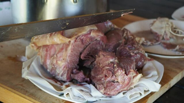cooking cappello del prete boiled meat , traditional dish from northern, Italy