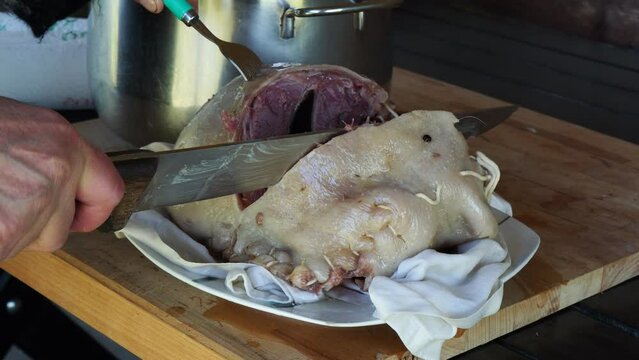 cooking cappello del prete boiled meat , traditional dish from northern, Italy
