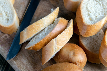 wheat baguette cut into pieces on a cutting board