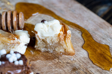 decorated dessert of sweet puff pastry with chocolate filling and natural honey