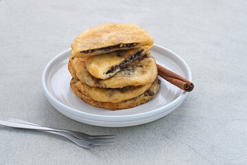 Hotteok, South Korean pancakes or fried dough with nuts and sugar filling, traditional street food. Selected focus.
