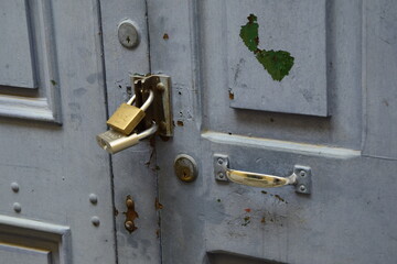 Two locks on an old wooden door, close-up. La Paz, Bolivia