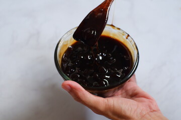tapioca pearls in brown sugar syrup or boba in a bowl