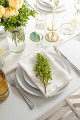 The wedding decor. Wedding teble decoration with white roses