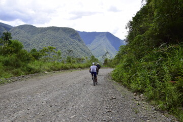 Fototapeta premium La Paz-Coroico, Bolivia - 29 January 2017: Cyclist on the Death road, Yungas North Road between La Paz and Coroico