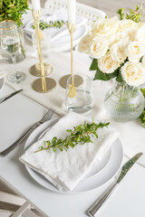 The wedding decor. Wedding teble decoration with white roses