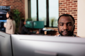 African american programmer developing high security application with multiple layers of...