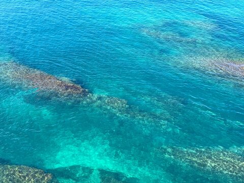 Sea turquoise blue water surface aerial view. Beautiful seascape. Harmony. Zen. Ocean. 
