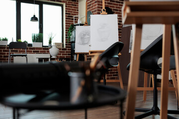 Empty drawing studio equipped with professional sketching tools ready for creative lesson. Contemporary artistic workspace helping student to develop artistic skill. Nobody in it