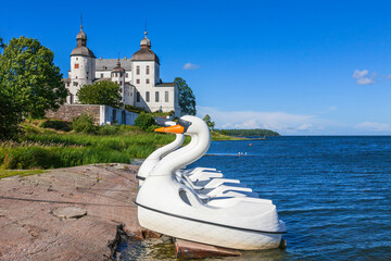 Beautiful view with pedal boats at the beach at Lacko castle in sweden