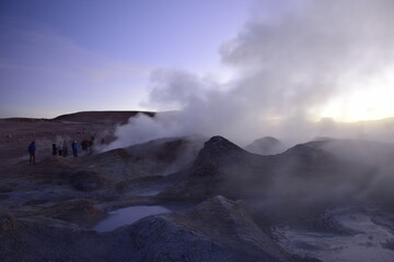 A geyser shoots out of the ground, a photo at dawn on a long exposure., on Eduardo Avaroa National Reserve in Uyuni