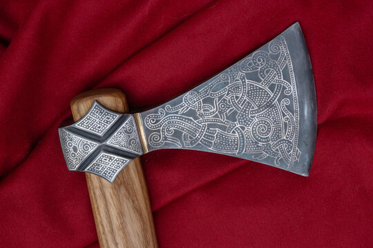Close-up of a richly ornamented viking axe.