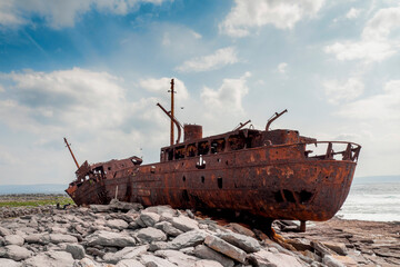 Plassey shipwreck on shore of Inisheer island. Aran islands, county Galway, Ireland. Rough stone...