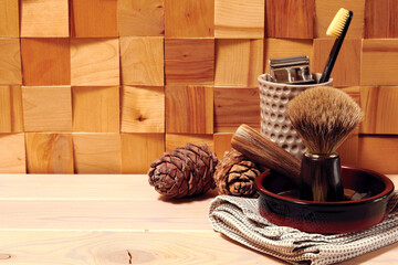 Fototapeta na wymiar Natural shaving tools,razor blade, brush and hygiene equipment. Wooden bathroom table. Copy space
