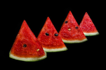 slice of watermelon on black background