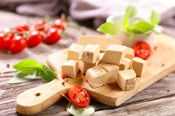 fresh tofu cutting with tomato and basil