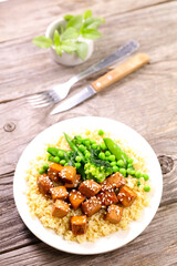 fried tofu with soy sauce, bulgur and green vegetable