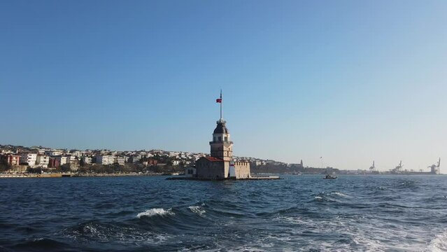 Kiz Kulesi or Maiden's Tower with Salacak coast of Uskudar District in Istanbul from a ferry. Travel to Istanbul background video.