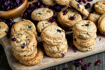 delicious dried cookies made of high-quality flour with dried red cranberries on the table