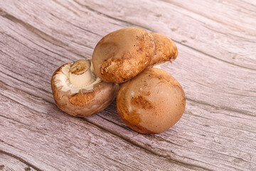 Raw brown champignons mushroom heap