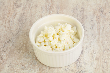 Grained cottage cheese in the bowl