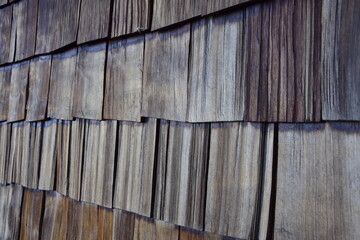 Old wooden tiles on the facade of the house. Puerto Varas, Chile.