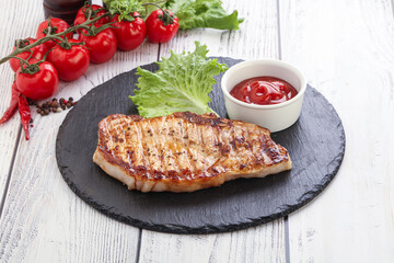 Grilled pork steak with ketchup