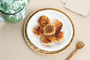 Wingko or Wingko Babat, a traditional Indonesian snack made from grated young coconut, glutinous rice flour, and sugar. Selected focus.
