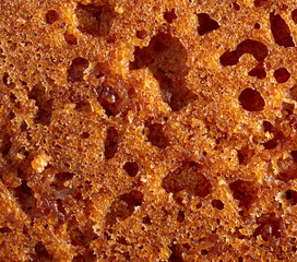 Crust on ruddy cookies as an abstract background.