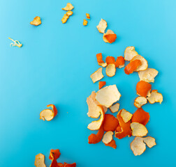 Mandarin peel on a blue background.
