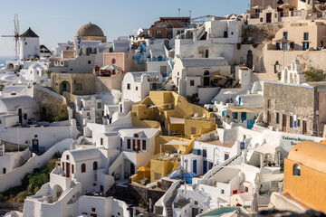 Whitewashed houses and windmills in Oia on Santorini island, Cyclades, Greece