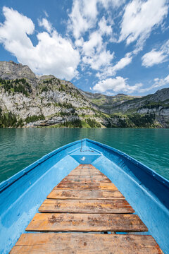 Boat ride on Oeschinensee (Oeschinen Lake) in summer, Kandersteg, Bernese Oberland, Switzerland