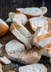 sliced loaf of bread on a cutting wooden board
