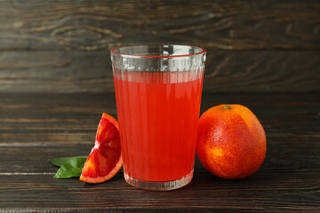 Concept of drink, red orange juice on wooden table