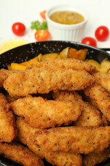 Concept of tasty food with chicken strips, close up