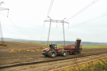 Odessa, Ukraine - 20 january 2022: Tractor harvest beets in the field in autumn season