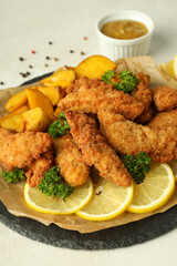 Concept of tasty food with chicken strips, close up