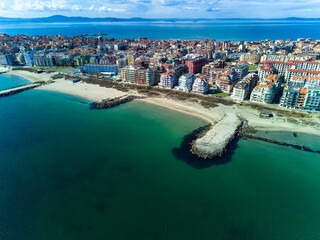 Panoramic view from a height above the town of Pomorie with houses and streets washed by the Black Sea in Bulgaria