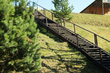 Long wooden steps in sunny day in Carpathians