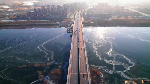 The bridge over the river in winter