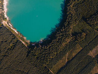 aerial view of lake with blue water near forest