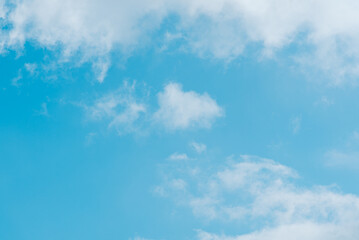 Bright blue sky with white fluffy clouds. Beauty of nature. Aerial natural background