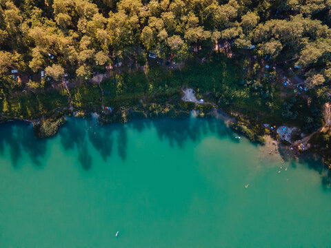 aerial view of camp site near lake in forest