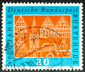 GERMANY - CIRCA 1959: a stamp printed in the Germany shows Buildings, Buxtehude, Millennium of Town of Buxtehude, circa 1959 - Powered by Adobe