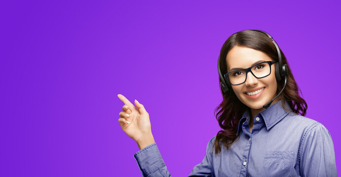 Contact Call Center Service. Customer support, female sales agent in glasses. Caller or answer phone operator or businesswoman in headset. Woman showing empty copy space text area, isolated on violet.