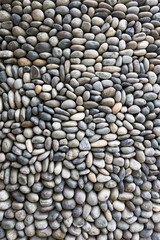 Vertical shot of cobblestones background .  Close up view