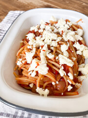 Spaghetti with chickpeas, cheese and tomato sauce