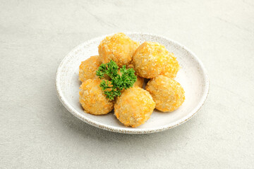 Delicious homemade bitterballen made from flour, cheese, milk coated with bread crumb filled with mozzarella. Selective focus image.